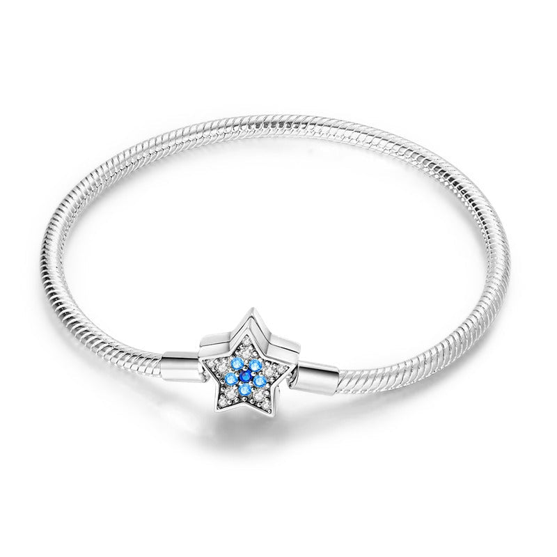 Bracelet argent enfant fille maille serpent avec étoile scintillante aux reflets bleutés