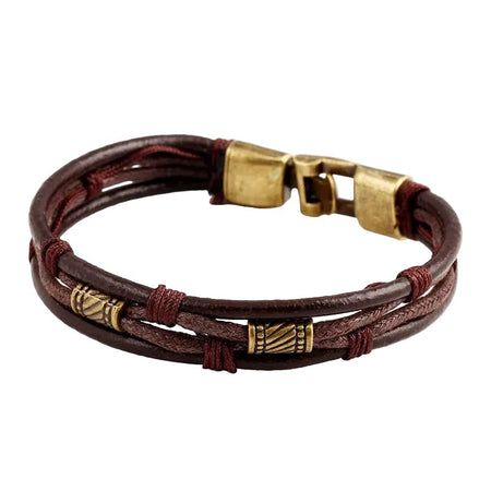 Bracelet artisanal homme en cuir brun multirangs doté d'entretoises cylindriques dorées vieillies gravées