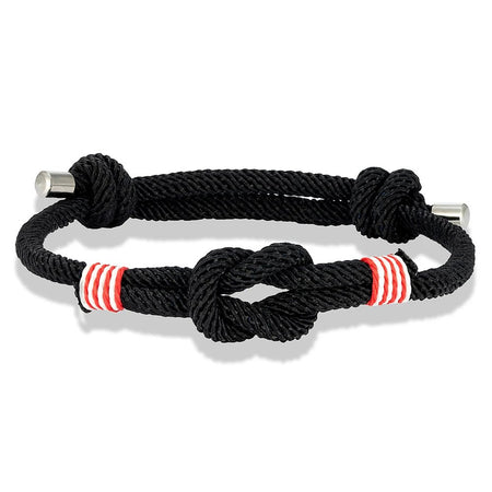 Bracelet nautique homme au cordage noir avec nœud marin central, surliures rouge-blanc et embouts acier