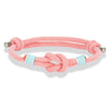 Bracelet nautique homme cordage rose avec nœud marin central, surliures blanc-turquoise et embouts acier