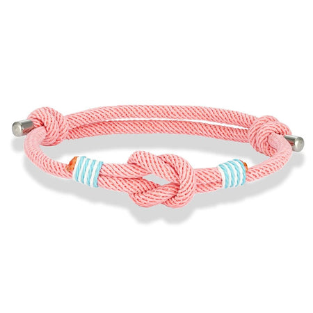 Bracelet nautique homme cordage rose avec nœud marin central, surliures blanc-turquoise et embouts acier