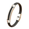 Bracelet haut de gamme homme en cuir tressé noir doté de surpiqûres ivoire et d'une plaque centrale en acier poli effet miroir