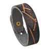Bracelet homme artisanal en cuir vachette noir à incisions tribales révélant un cœur brun fauve