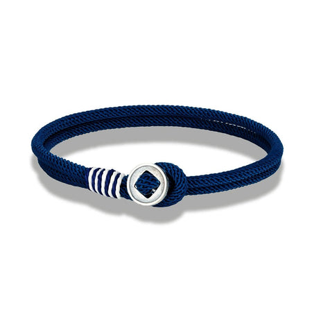 Bracelet homme cordon nylon bleu marine torsadé doté d'une surliure blanche et d'un fermoir bouton en argent