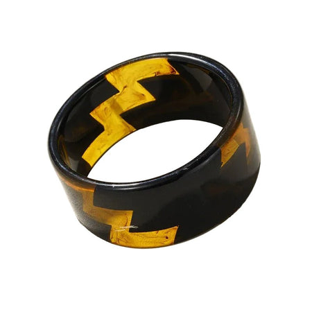 Bracelet manchette femme large noir en résine polie aux éclats ambrés translucides à motifs géométriques