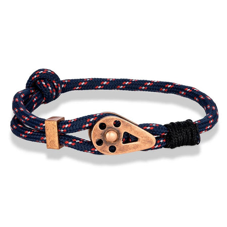 Bracelet homme marin cordage nylon tressé bleu marine ponctué de fils rouge et blanc avec pendentif poulie de bateau patiné cuivre