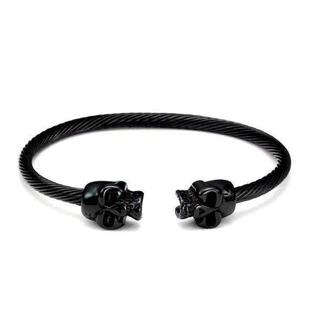 Bracelet acier pour homme câble torsadé têtes de mort sculptées finition noire