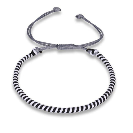 Bracelet cordon tressage bicolore noir blanc motif spirale nœud coulissant gris