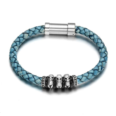 Bracelet cuir tressé bleu patiné homme avec trois têtes de mort acier argenté style rock rebelle