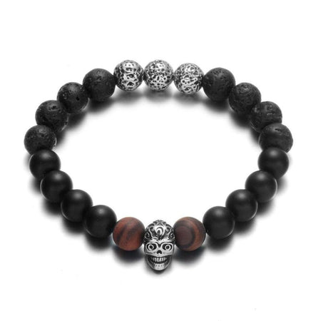 Bracelet homme perles noires volcaniques avec tête de mort argentée sculptée et accents brun-rouge